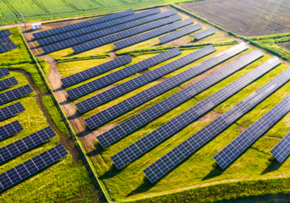 Solar panels on a green field